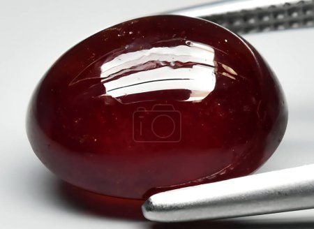 Photo for Natural red hessonite garnet gem on background - Royalty Free Image