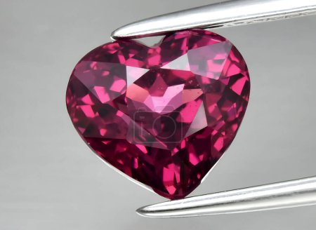 Photo for Natural pink rhodolite garnet gem on background - Royalty Free Image