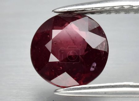 Photo for Natural pink red rhodolite garnet gem on background - Royalty Free Image