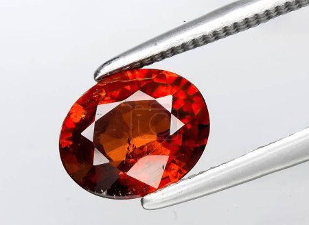 Photo for Natural red spessartite garnet gem on background - Royalty Free Image