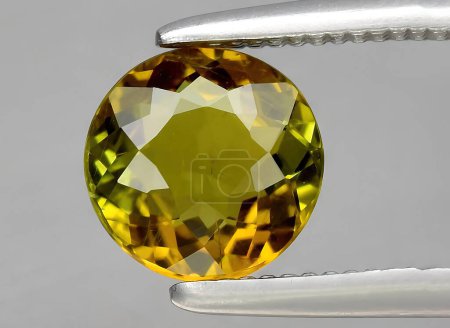 Photo for Natural yellow tourmaline dravite gem on background - Royalty Free Image