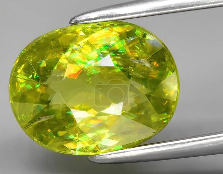 Photo for Natural green yellow sphene titanite gem on background - Royalty Free Image