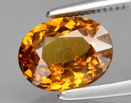 Photo for Natural yellow grossular garnet gem on background - Royalty Free Image