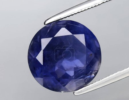 Photo for Natural blue iolite kordierite gem on background - Royalty Free Image