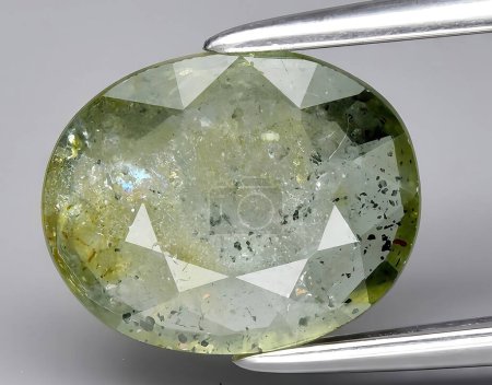 Photo for Natural green sapphire gem on background - Royalty Free Image