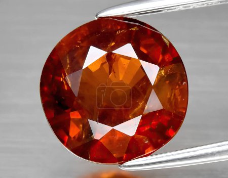 Photo for Natural red spessartite garnet gem on background - Royalty Free Image
