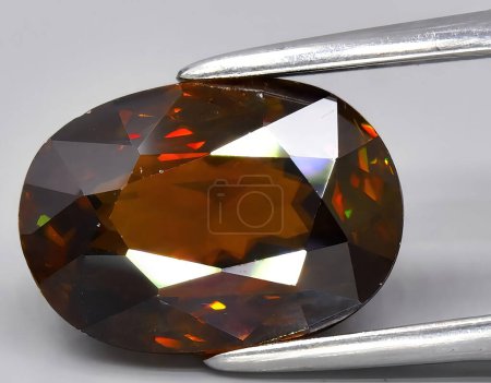Photo for Natural brown sphene titanite gem on background - Royalty Free Image