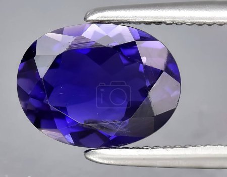 Photo for Natural blue violet iolite gem on background - Royalty Free Image
