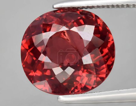 natural red pyrope garnet gem on background