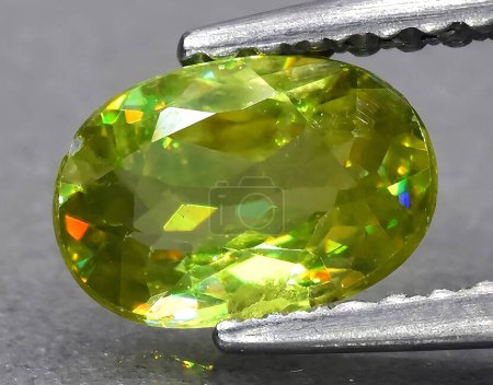 Photo for Natural green sphene titanite gem on background - Royalty Free Image