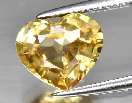 Photo for Natural yellow zircon gem on background - Royalty Free Image