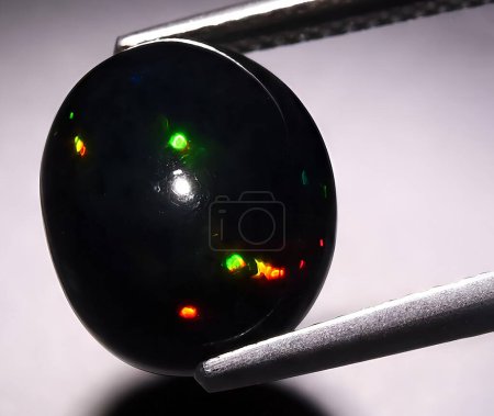 natural multi color rainbow opal gem on background