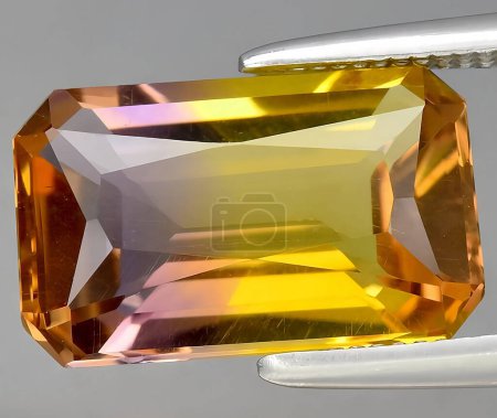 natural bi color ametrine quartz gem on background