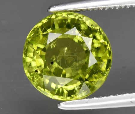 natural green peridot chrysolite gem on background