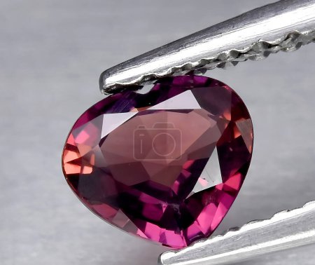 natural pink sapphire rough gem on background