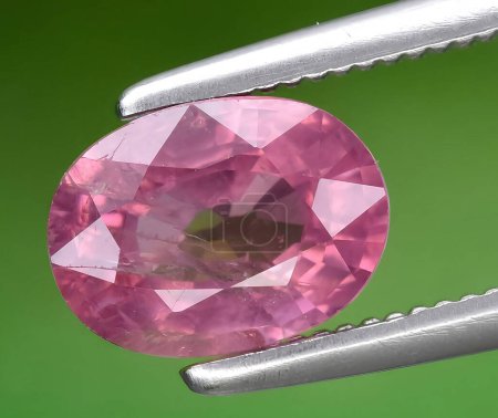natural pink spinel gem on background