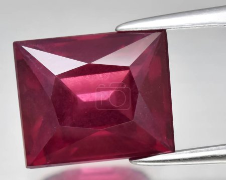 Photo for Natural red rhodolite garnet gem on background - Royalty Free Image