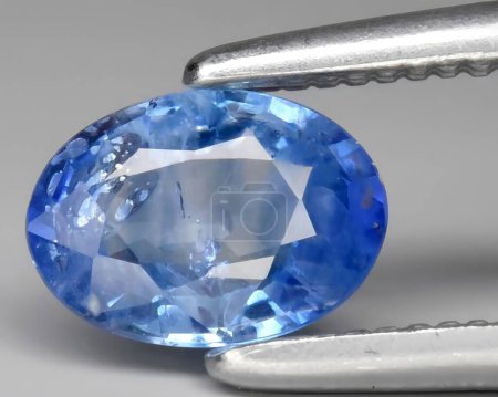natural blue sapphire gem on background