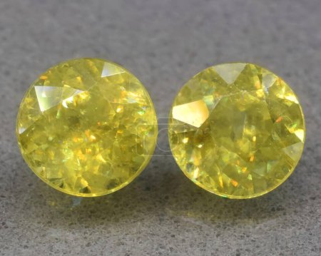 Photo for Natural yellow sphene titanite gem on background - Royalty Free Image