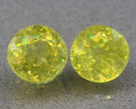 natural yellow sphene titanite gem on background