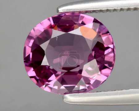 Photo for Natural purple rhodolite garnet gem on background - Royalty Free Image