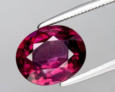 Photo for Natural red pink garnet rhodolite gem on background - Royalty Free Image