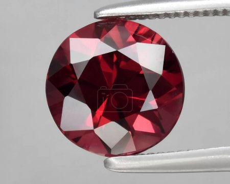 Photo for Natural red garnet rhodolite gem on background - Royalty Free Image