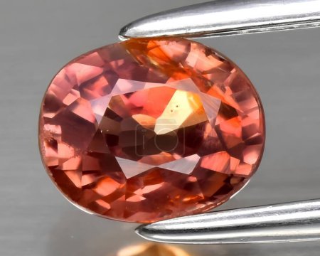 natural padparadscha orange sapphire gem on background