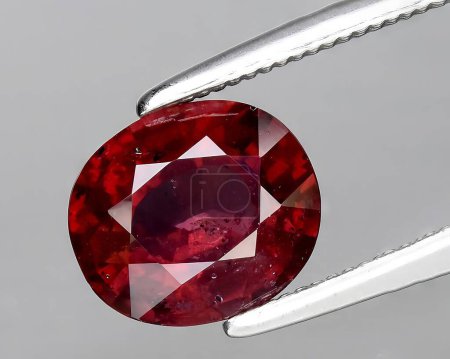 natural pink red rhodolite gem on background
