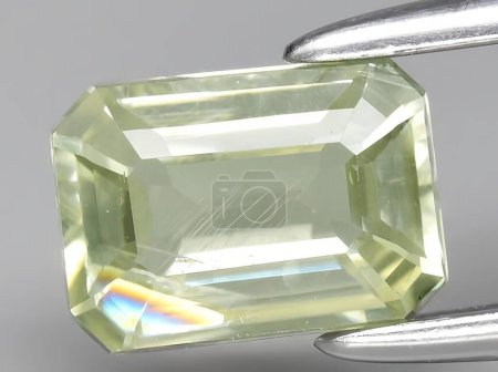 Photo for Natural yellow diaspore sultanite gemstone on background - Royalty Free Image