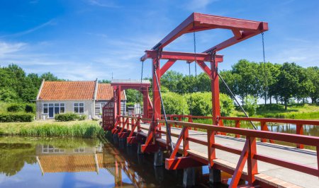 Red wooden bridge in historic village Bourtange, Netherlands