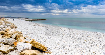 Panorama of the stone beach at the sea in Marina di Pisa, Italy