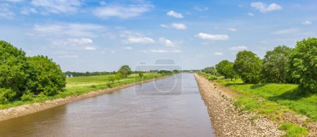 Panorama of the river Ems going through the landscape in spring near Papenburg, Germany