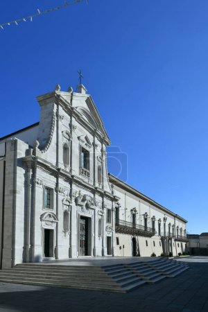 Foto de The facade of the cathedral and the bishop's palace in Melfi, a square of the historic town in southern Italy. - Imagen libre de derechos