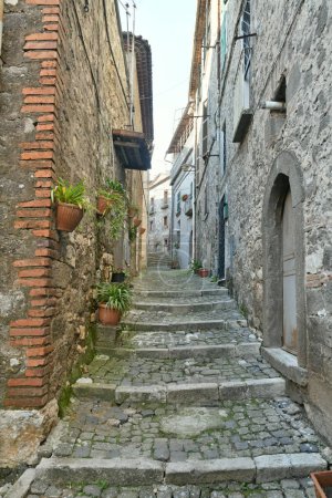 Photo for A narrow street in the historic center of Patrica, an old village in Lazio in the province of Frosinone, Italy. - Royalty Free Image