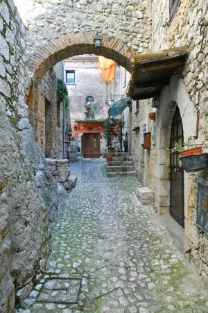 Photo for A narrow street among the old houses of Fumone, a historic town in the state of Lazio in Italy. - Royalty Free Image