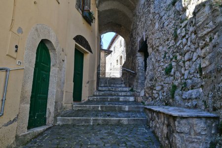 Photo for A narrow street among the old houses of Torre Cajetani, a historic town in the state of Lazio in Italy. - Royalty Free Image