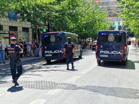 Photo for Granada, Spain, May 1st, 2023. Police guarding the demonstration of unions, political parties for workers rights on May 1st. - Royalty Free Image