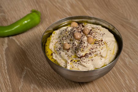 Photo for Hummus, also spelled Houmous or Hommus a Jordanian or Israeli Chickpea Dip or Spread - Royalty Free Image