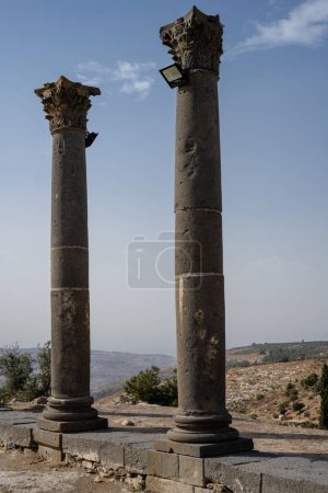 Photo for Corinthian Black Basalt Columns on the Roman Church Terrace of Gadara in Umm Qays, Jordan - Royalty Free Image