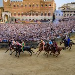 Siena, Italy - August 17 2021: Mossa or Start of the Public Horse Race Palio di Siena on the Main Square