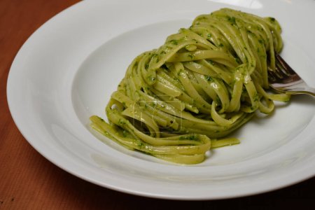 Photo for Trenette or Linguine Pasta with Green Pesto alla Genovese with Basil - Royalty Free Image