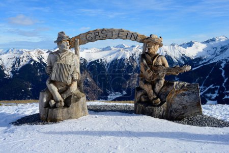 Photo for Bad Gastein Ski Resort Mounain Winter Panorama with Snow and Wooden Sculpture with Lettering - Royalty Free Image