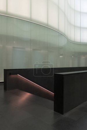 Photo for Black stair with LED lights on in a modern room surronded by glass wall. Nobody inside - Royalty Free Image