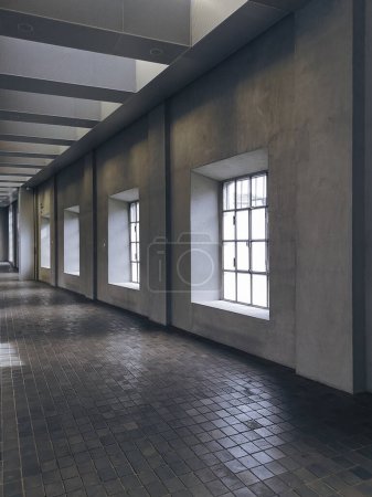 Photo for Corridor illuminated by bright windows. Modern space in old factory. Nobody inside - Royalty Free Image