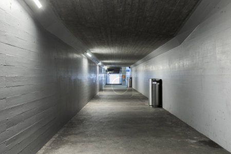 Photo for Long concrete pedestrian corridor that passes under the train station in Melide in Switzerland. Nobody inside - Royalty Free Image
