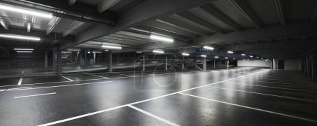 Téléchargez les photos : Garage souterrain moderne avec des lampes éclairant la scène. Des lignes de stationnement sont tracées sur le sol. Personne à l'intérieur - en image libre de droit