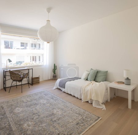 Photo for Bedroom interior with bed and large window. No people inside. These are modern rooms with white walls in the floor a carpet. - Royalty Free Image