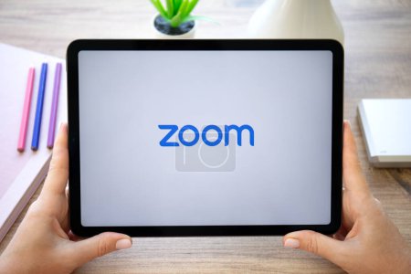 Photo for Alanya, Turkey - October 20, 2022: Woman hands hold Apple iPad Air Space Gray with calling Zoom Video Communications application. - Royalty Free Image