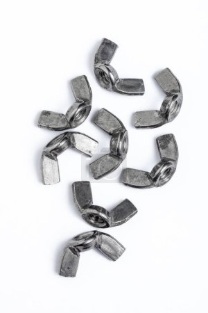Eight iron wingnuts isolated on white background